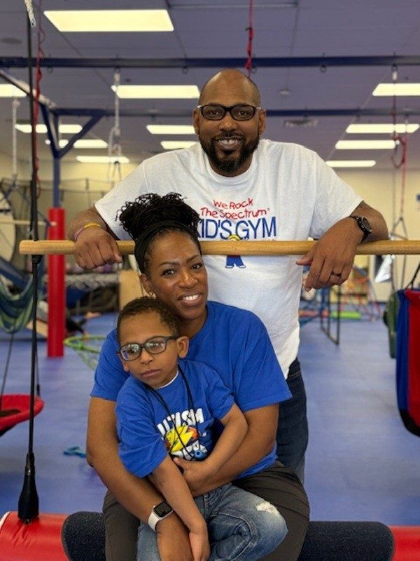 Andrea, Jason, and their child at We Rock the Spectrum Franklin